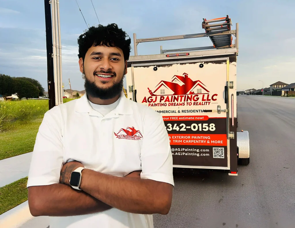 Owner of Austin TX painting company standing in front of branded business car